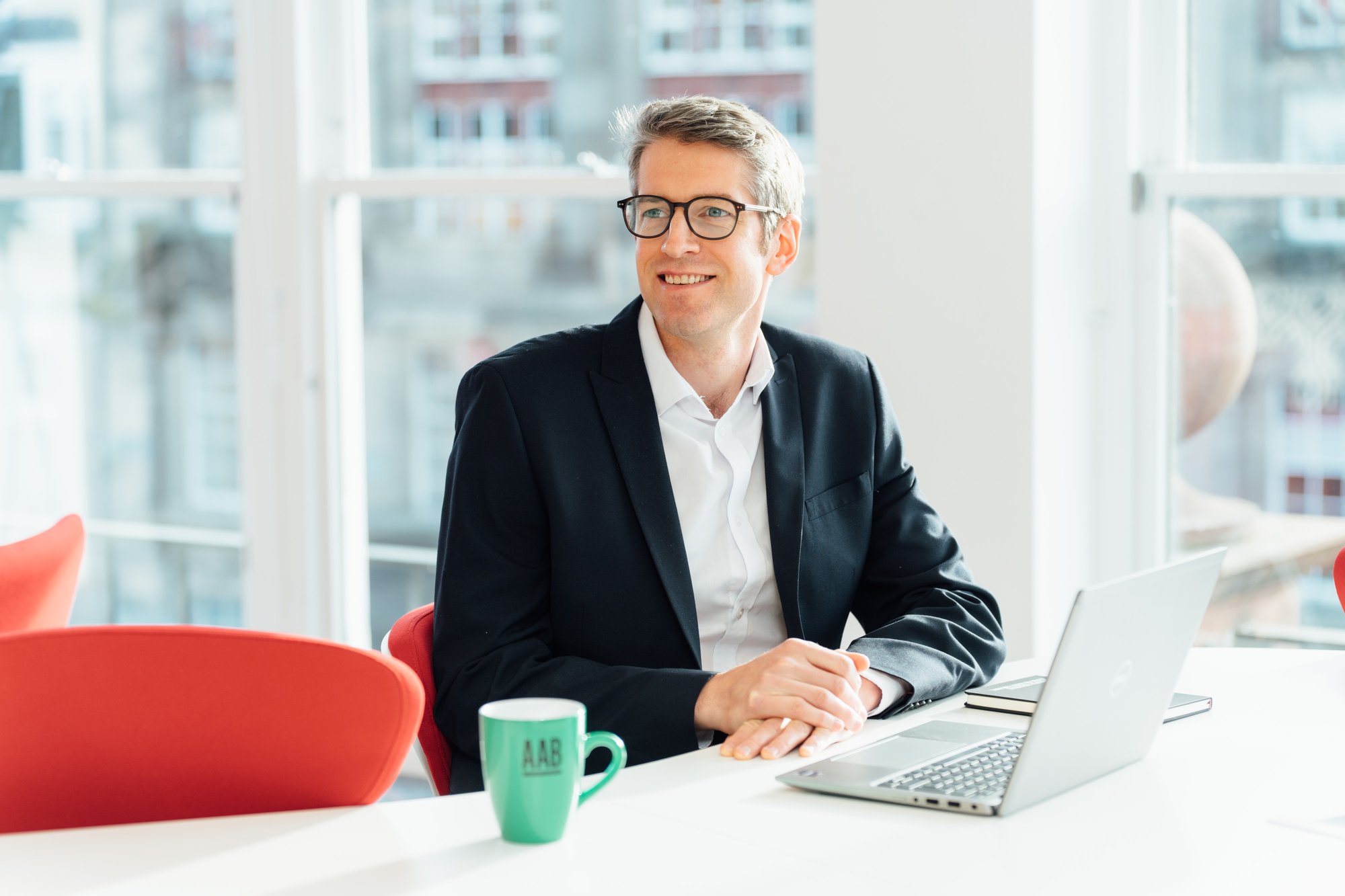 AAB Team member sitting at a desk