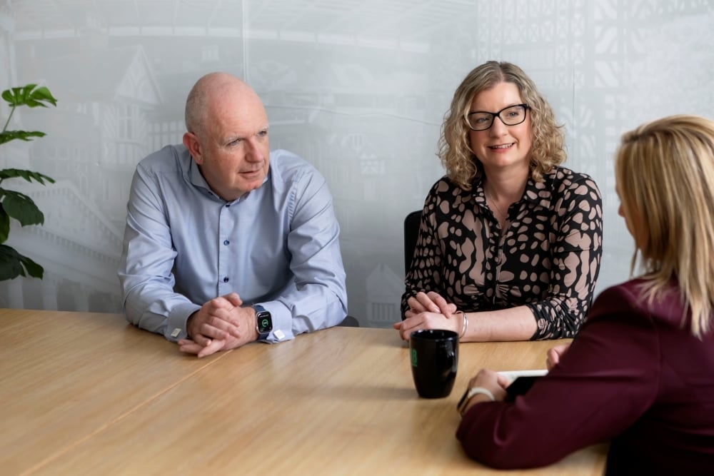 AAB team members listening to a client