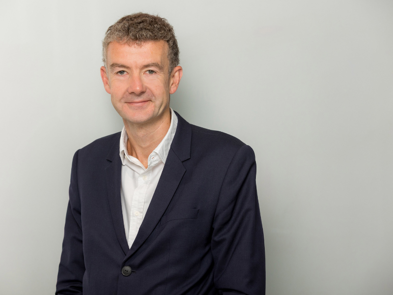 An image of Mark Lappin wearing a blazer with a white shirt.